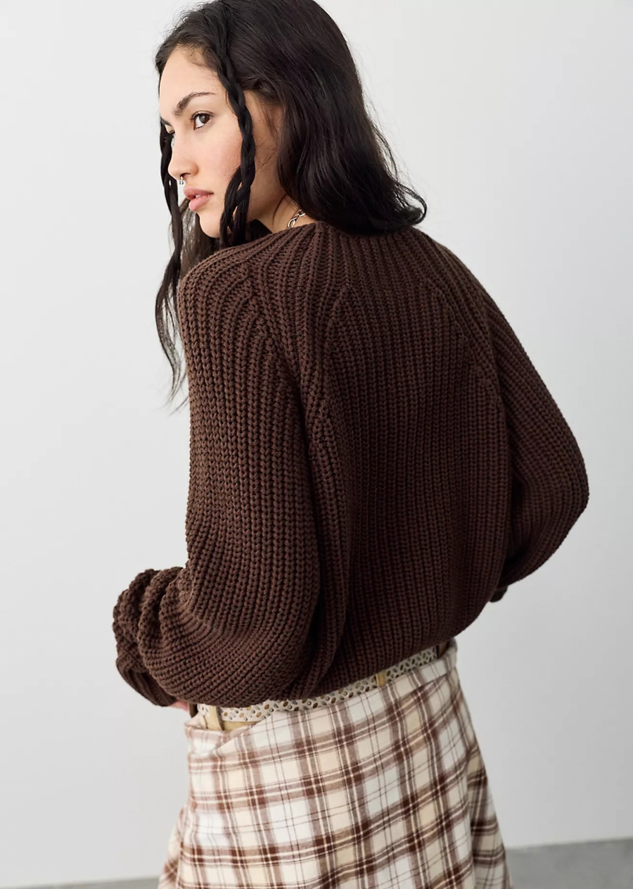 Perfect for rainy days or breezy moments, this laid-back pullover features a relaxed, longline silhouette, a lightweight cotton-blend, and a knitted design for a classic feel.