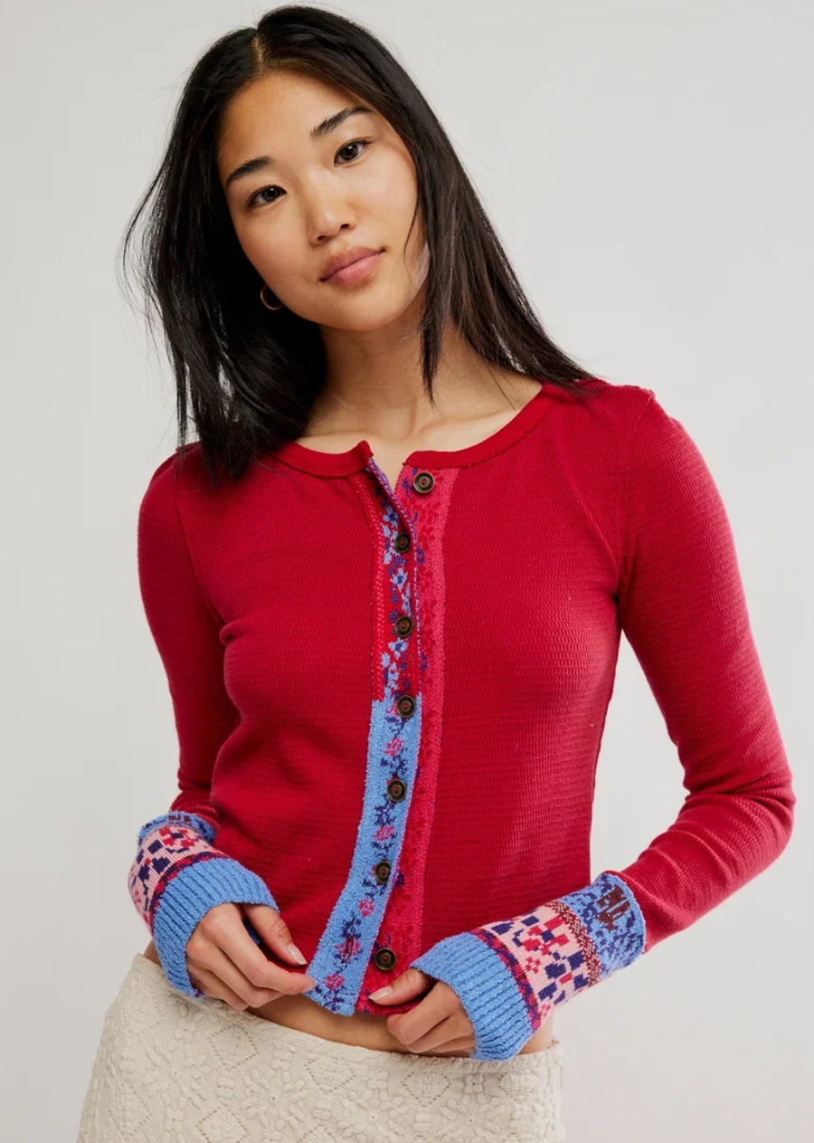 A quintessentially FP look, this charming cardi from the We The Free&nbsp;collection features a flattering, fitted silhouette, a ribbed cotton fabrication, and bold embroidered paneling and cuffs for an added touch.