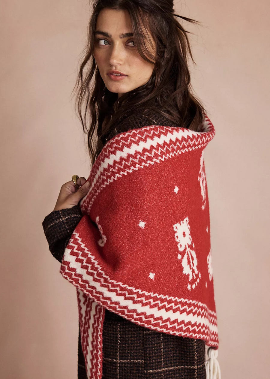 The perfect piece to layer over your outerwear, this forever classic shawl is featured in a cozy knit fabrication and staple triangle silhouette, ideal to drape over your shoulders all season long.