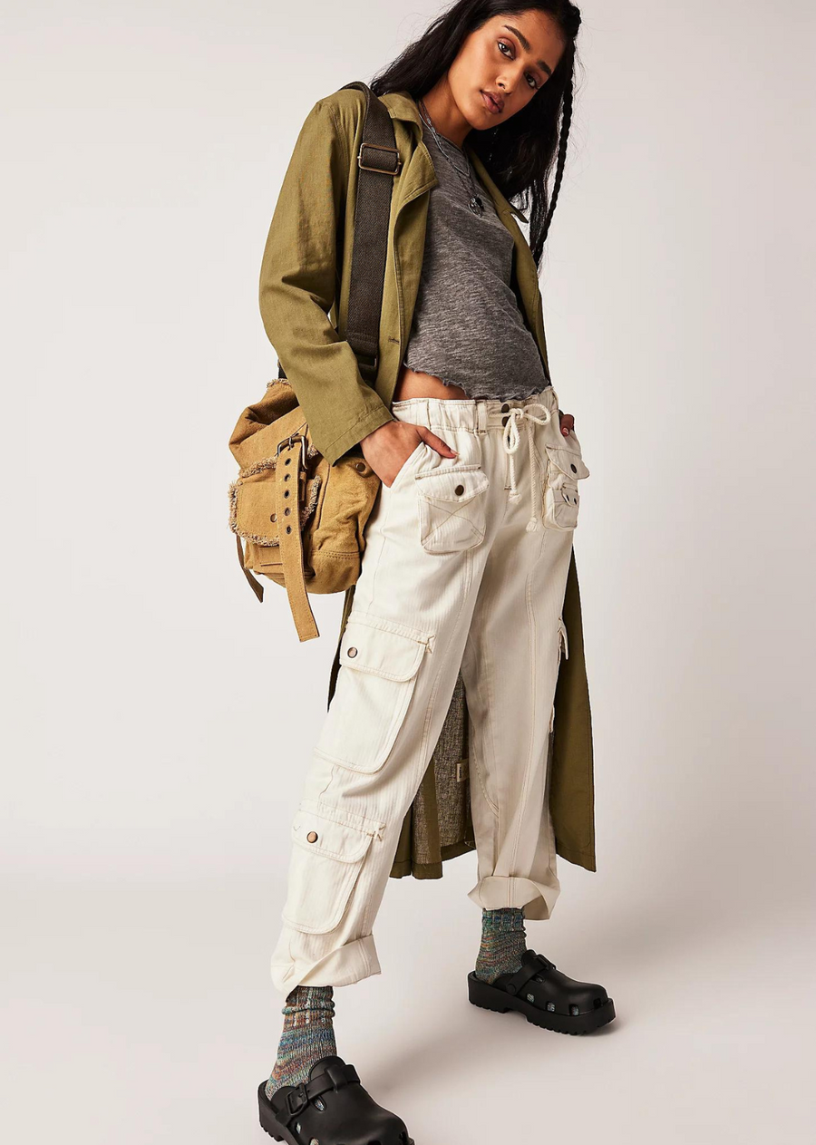 Free People Tahiti Cargo Pant. The coolest way to cargo, these timeless pants are featured in a low-rise, slouchy straight silhouette with utility-style pockets throughout and smocked waist for ease.