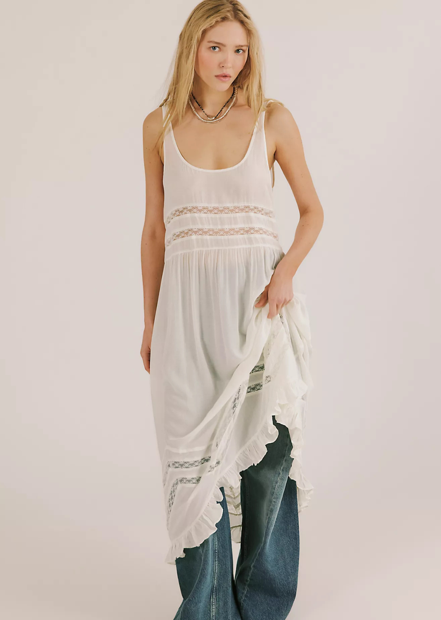 Lovely and lightweight, this darling midi slip from Intimately is made with layering and effortless styling in mind, featuring delicate ruffled trim, sheer floral lace panels throughout, a relaxed fit, and gathering details at the waist for a flowy, floating silhouette.