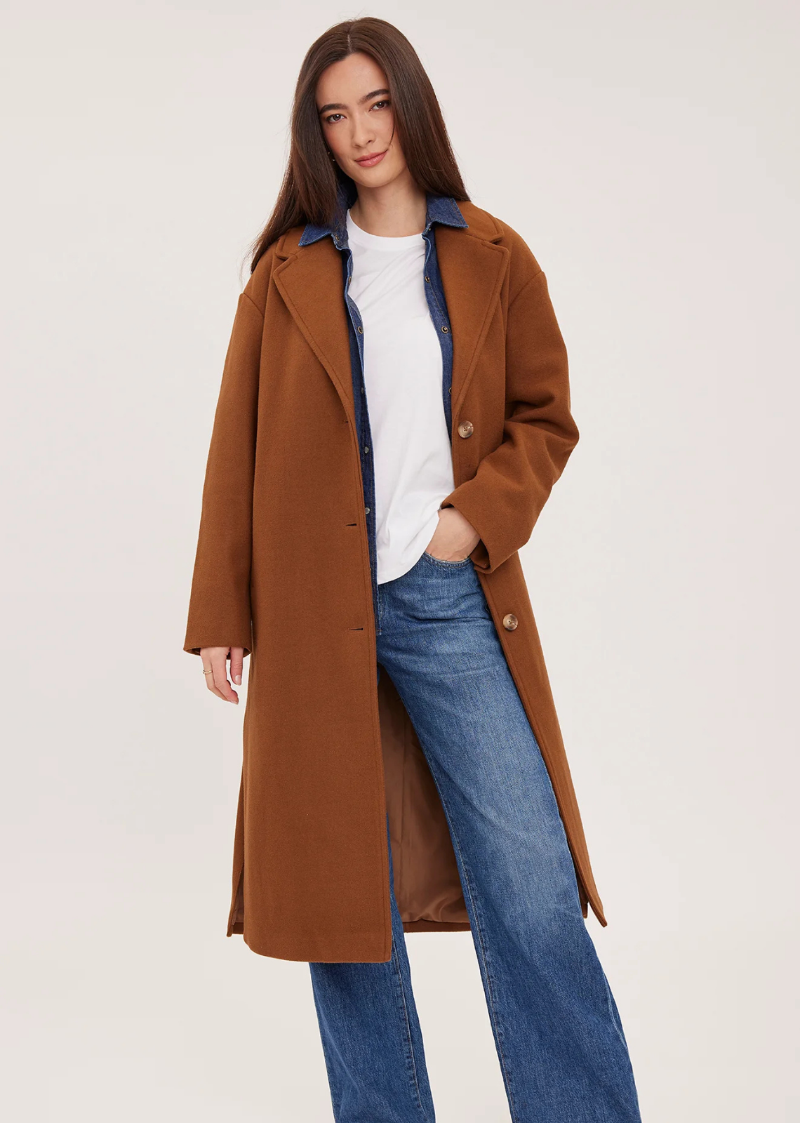 The Agatha coat is made of a soft, brushed melton fabric and is fully lined. Features include a front button closure, welt pockets, and side slits.