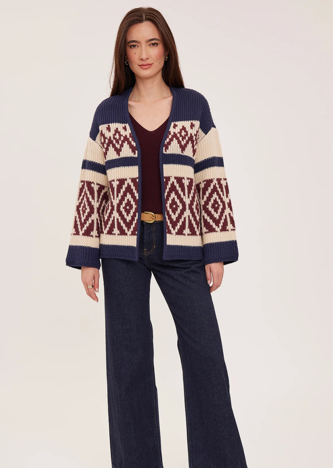 The Dorian cardigan is made of a soft, cozy yarn. Features include a custom jacquard pattern and relaxed fit.
