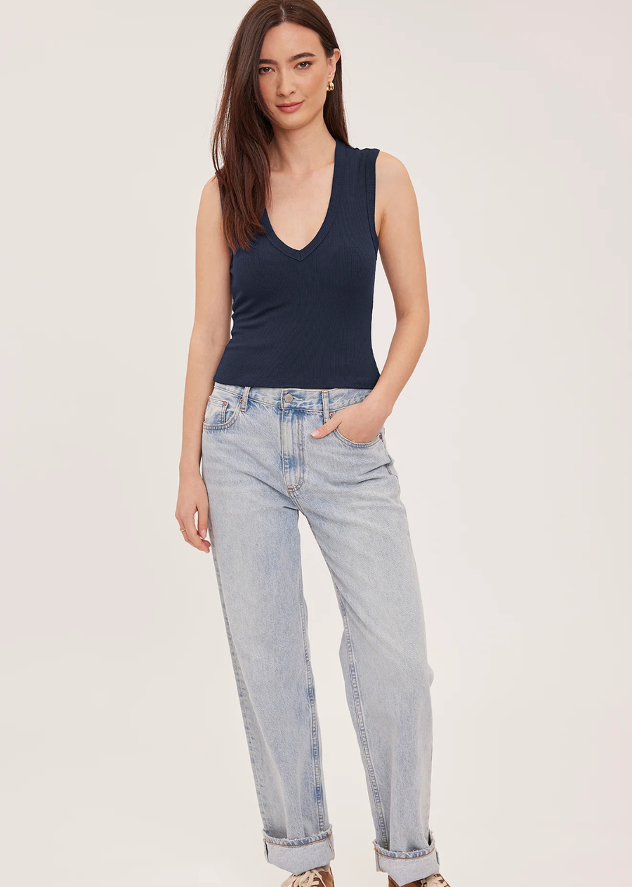 The Crawford top is made of a stretchy ribbed fabric that hugs the body. Features include a v-neckline and perfectly cropped length.