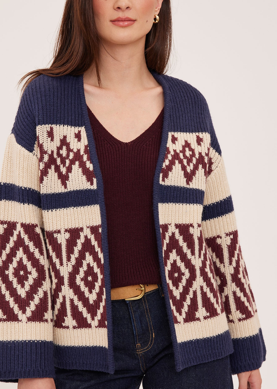 The Dorian cardigan is made of a soft, cozy yarn. Features include a custom jacquard pattern and relaxed fit.