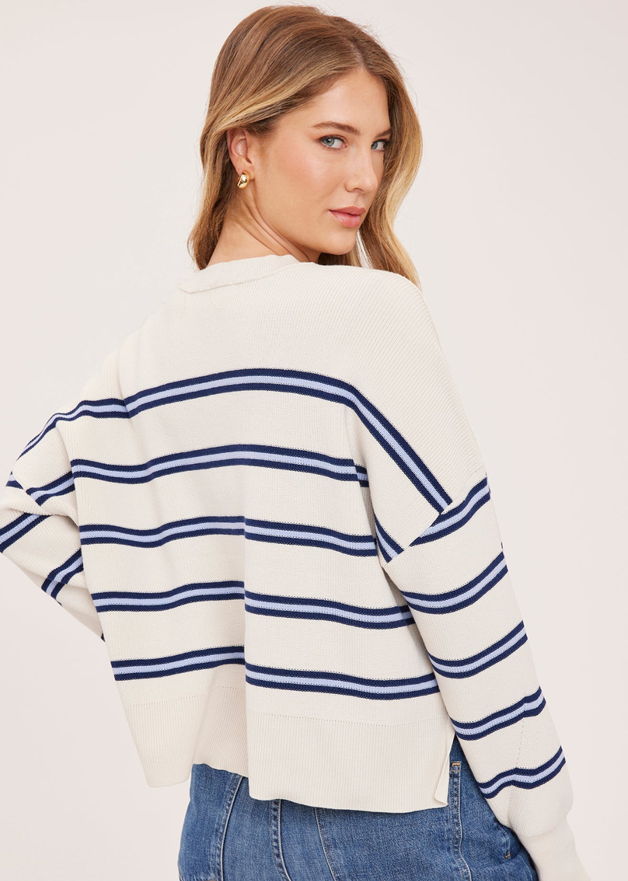 The Echo sweater is made of a super soft yarn in a half cardigan stitch. Features include exposed seam detailing and side slits for an effortless look.