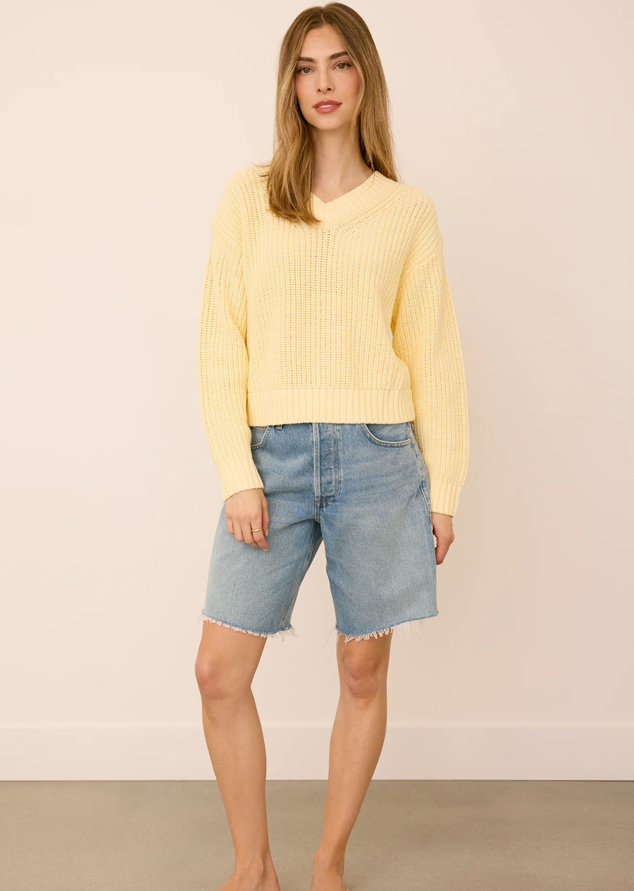 The Jocelyn sweater is made of a cotton blend yarn in a half cardigan stitch. Features include a v-neckline and relaxed fit.
