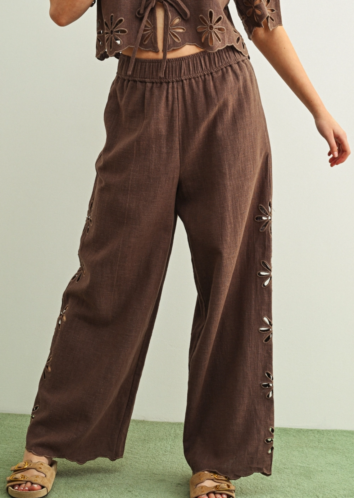 An effortlessly chic pull-on pant crafted from breathable linen for all-day comfort and ease. Designed with a relaxed wide-leg silhouette, elastic waistband, and delicate eyelet detailing along the sides for a subtle feminine touch. Pair with the Giselle Tie Up Top.&nbsp;