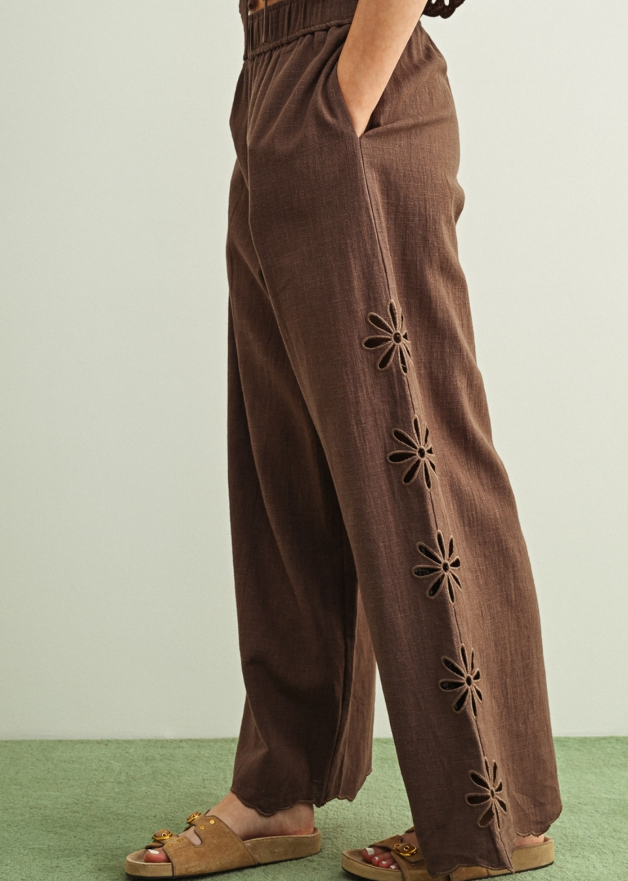 An effortlessly chic pull-on pant crafted from breathable linen for all-day comfort and ease. Designed with a relaxed wide-leg silhouette, elastic waistband, and delicate eyelet detailing along the sides for a subtle feminine touch. Pair with the Giselle Tie Up Top.&nbsp;