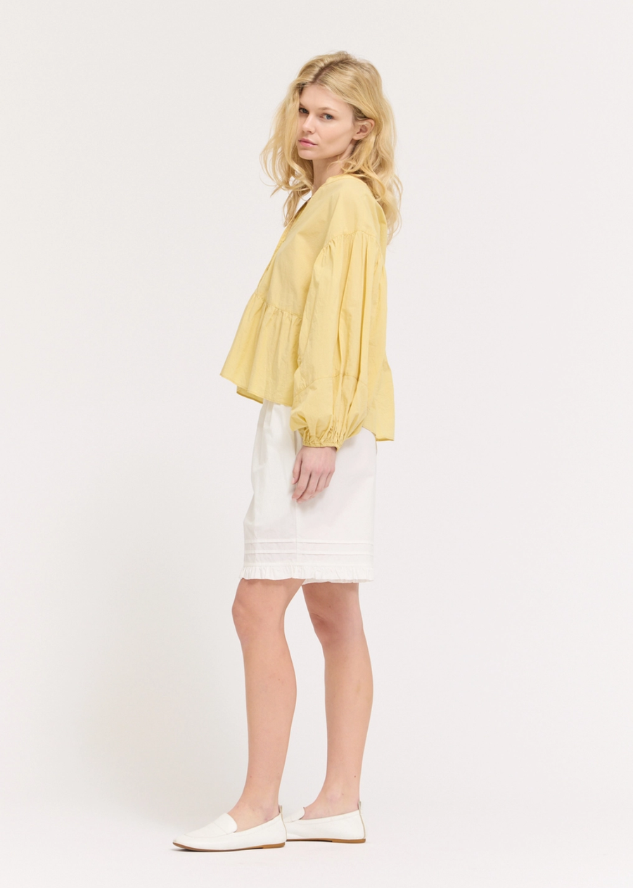 Romantic and effortlessly refined, this panel balloon sleeve blouse brings elevated style to any wardrobe. Designed with softly structured panel detailing and voluminous balloon sleeves, it creates a flattering silhouette with beautiful movement