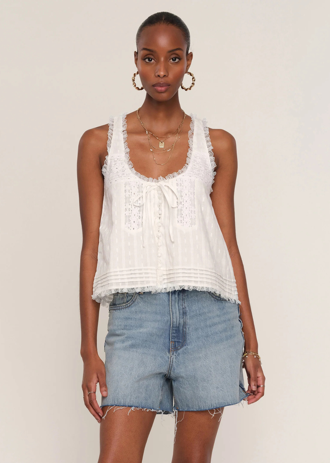 Inspired by some of our favorite, vintage blouses, the Ena Top exudes cool-girl chic. Made from a soft, cotton voile, it features pintucks, lace details and a flattering, scoop neck.