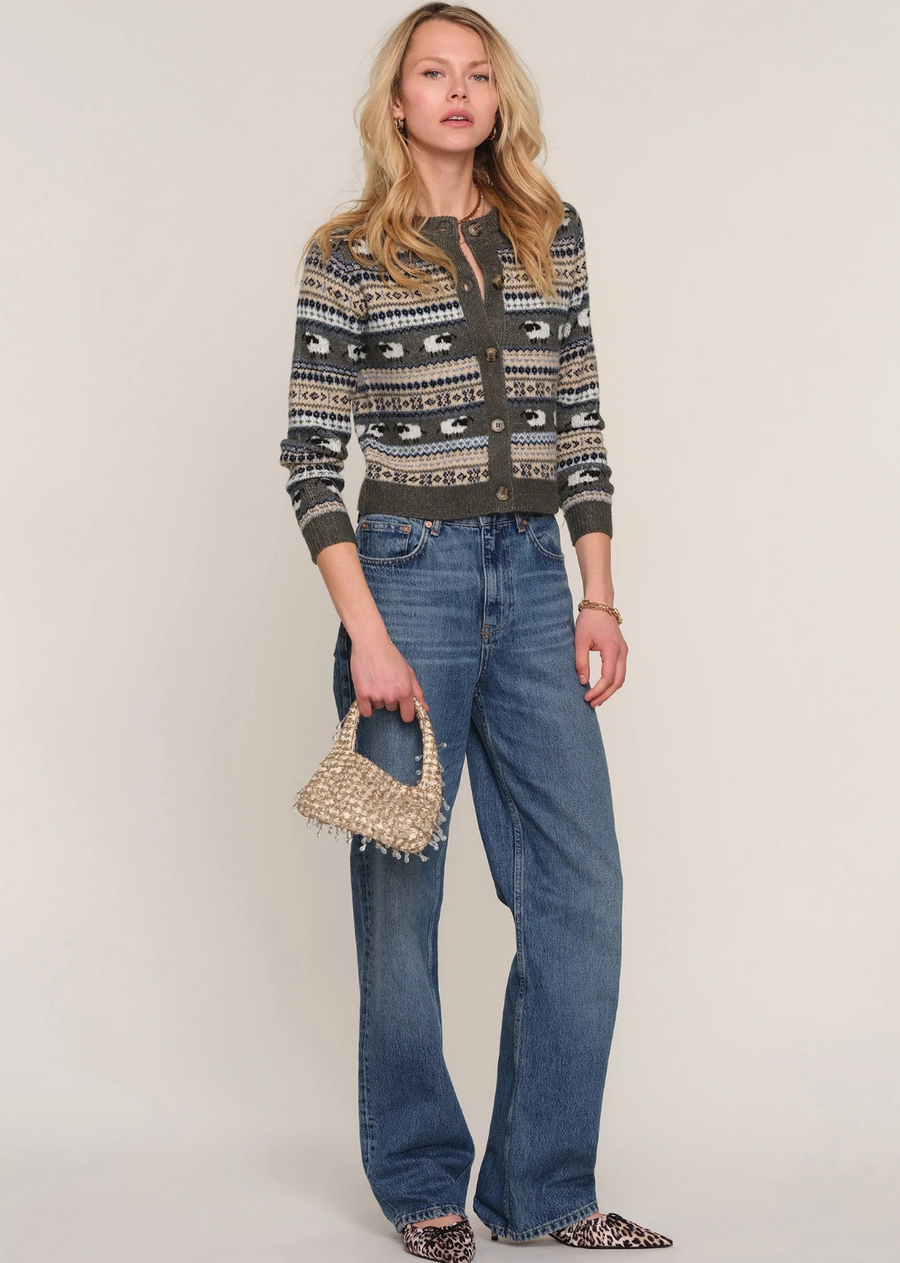 The Cole Cardi is the cutest cardigan of the winter. Made from a super soft yarn, it has a slim fit and crew neck. It features a fun sheep pattern throughout the body.