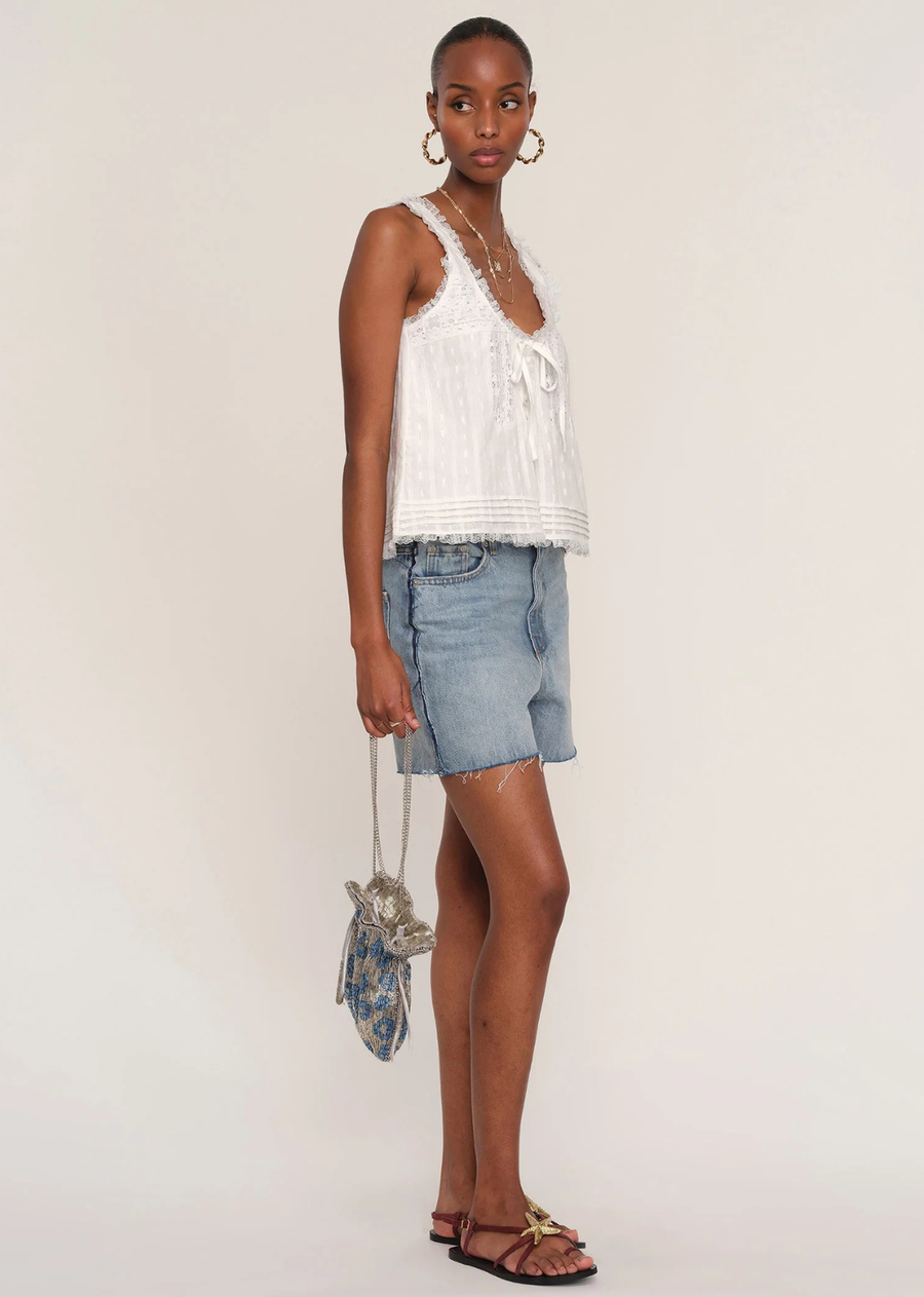 Inspired by some of our favorite, vintage blouses, the Ena Top exudes cool-girl chic. Made from a soft, cotton voile, it features pintucks, lace details and a flattering, scoop neck.
