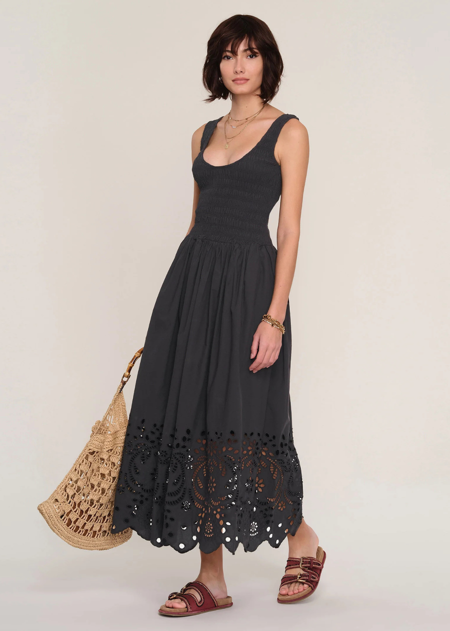 Made from a cotton poplin, the Gemma Dress is an effortless icon. It features a smocked bodice with a flattering scoop neck. The full skirt has a cotton eyelet detail with scalloped hem. Dress it up or dress it down.