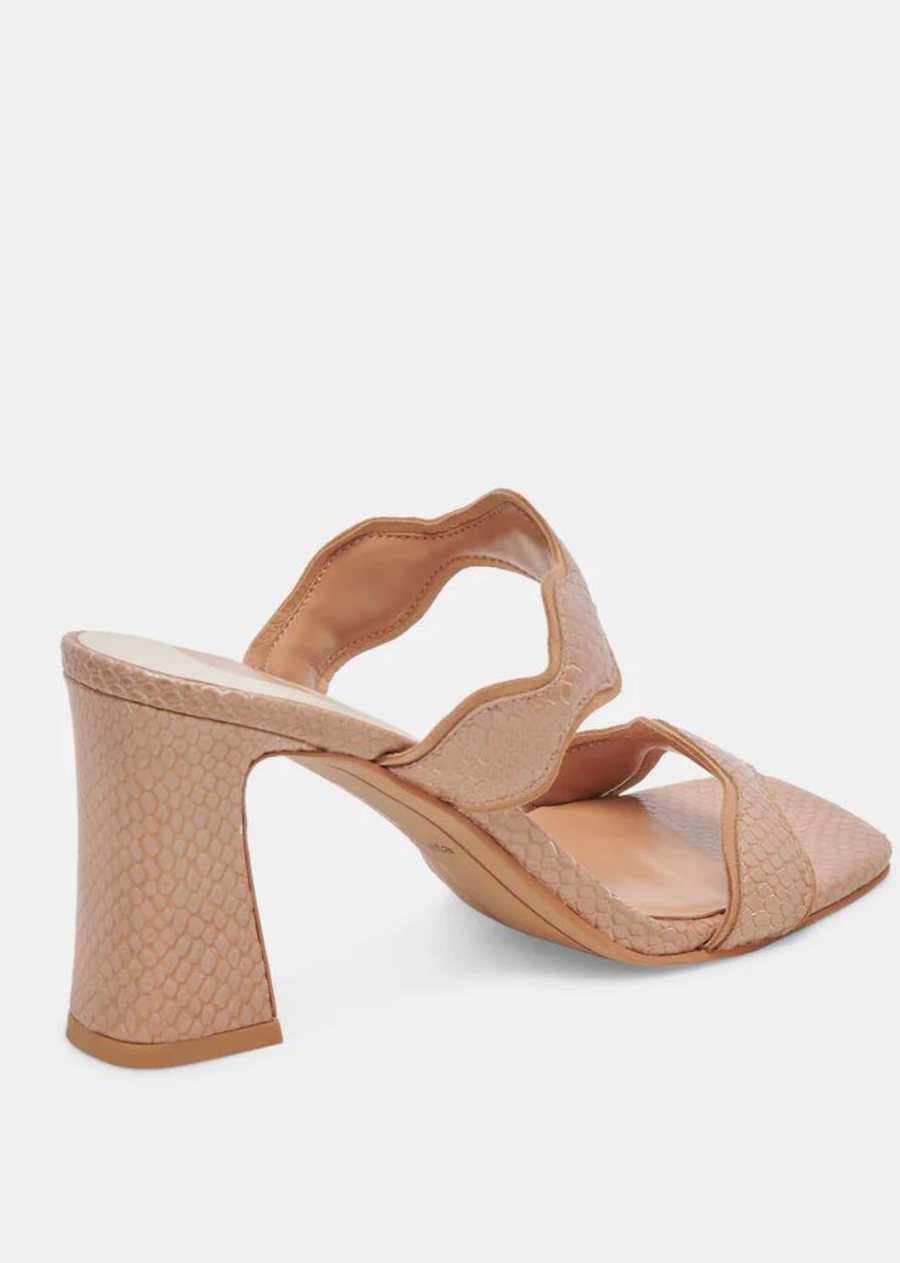 Dolce Vita Ilvia Heels- Toffee Embossed Leather. ILVA is the center of attention. A sculptural heel and scalloped straps make this the perfect party style. Choose from sophisticated suede hues or opt for statement-making leather.