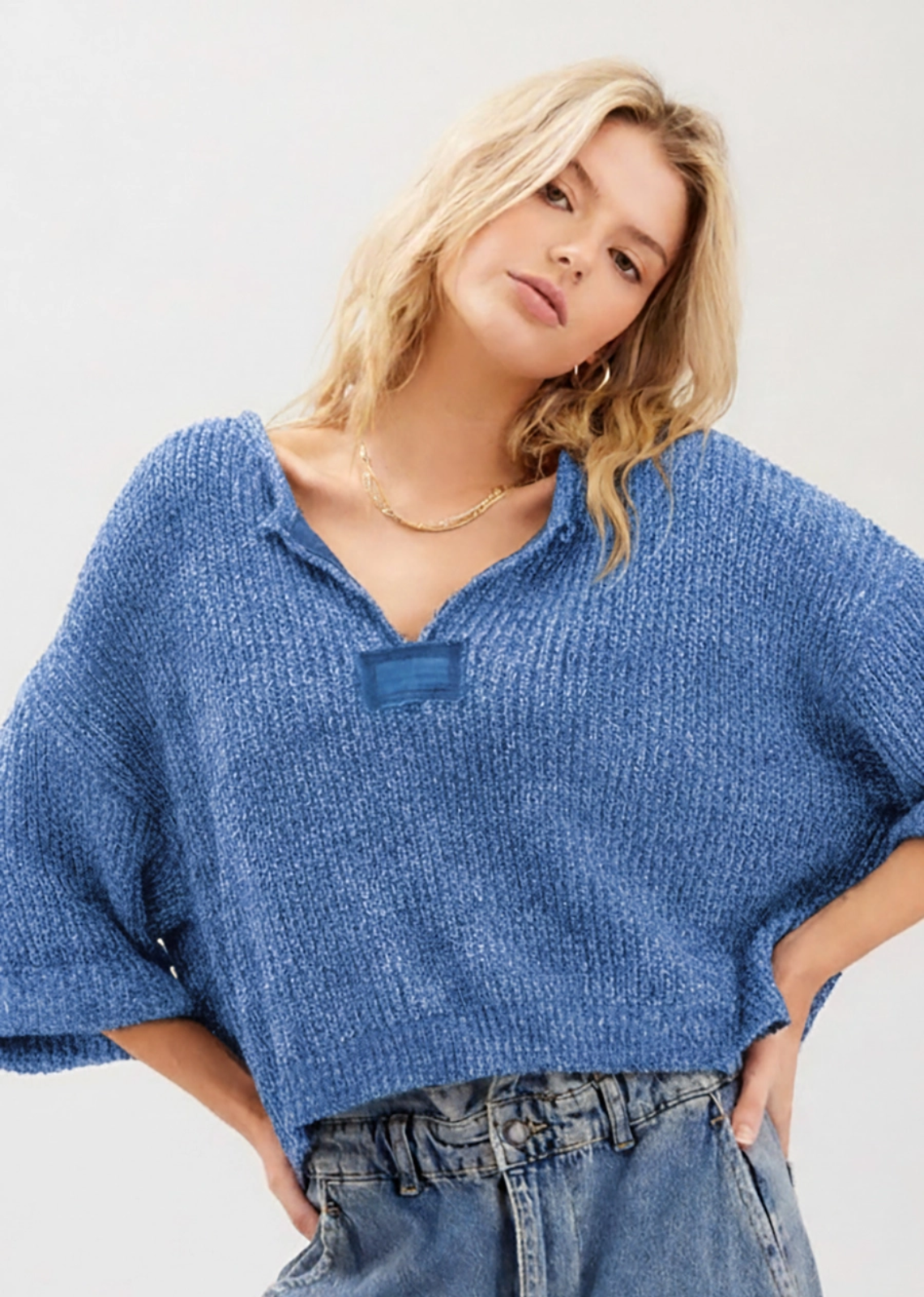Our signature slouchy cropped sweater featuring v-neckline, 3/4 sleeves, and solid patch at front and back. Wearable all year round.