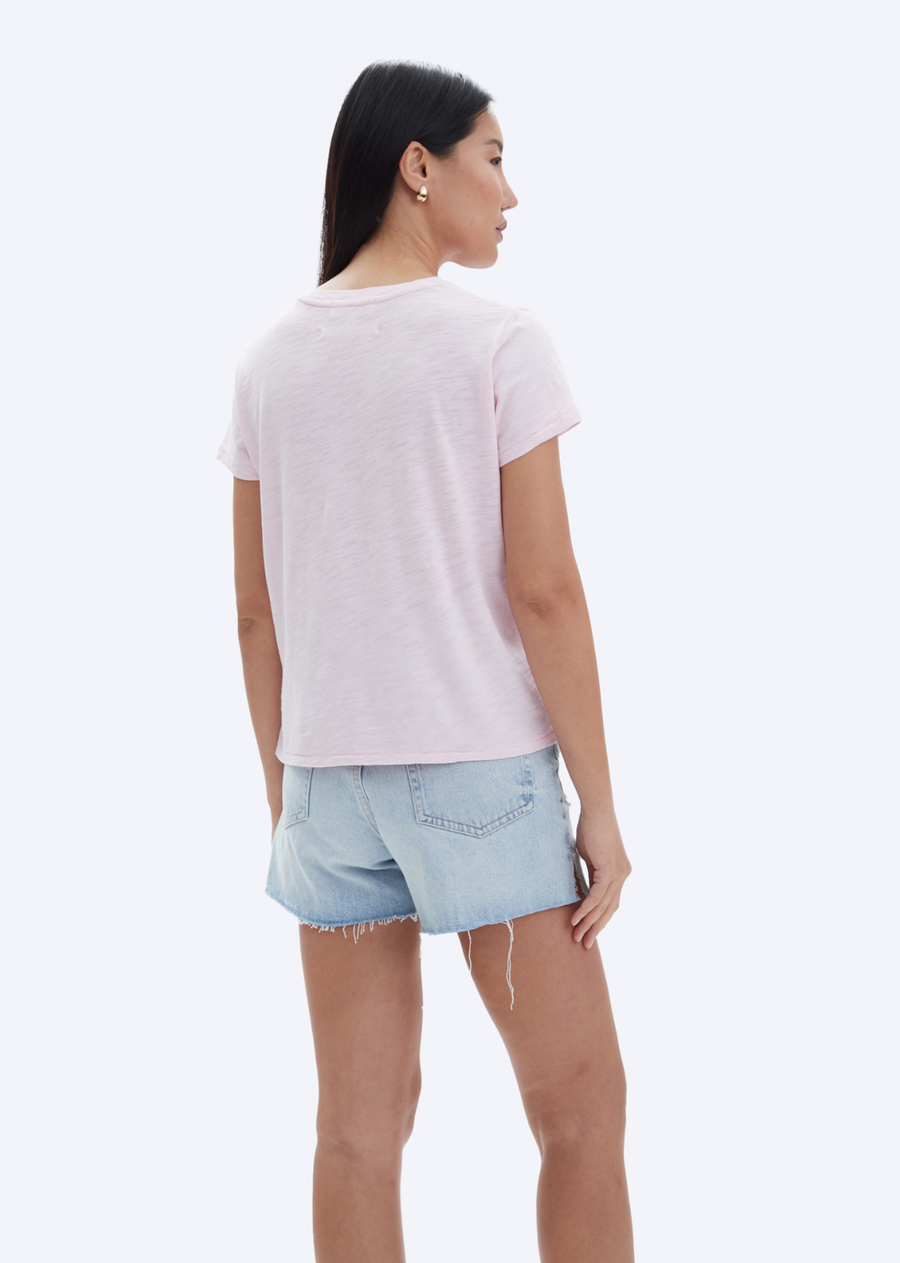 CHRLDR Jane Perfect Tee- Petal. This classic crew neck tee from CHRLDR boasts a slightly cropped design and a straight fit, providing a timeless and flattering look. Made with high-quality materials, this tee is a perfect addition to any wardrobe.