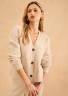 John & Jenn Braxton Cardigan- Birch. The Braxton cardi from John + Jenn is a stylish addition to any wardrobe. It features a 3-button closure, slightly cropped boxy fit and two front pockets. This cardigan is designed to provide a comfortable and flattering fit.