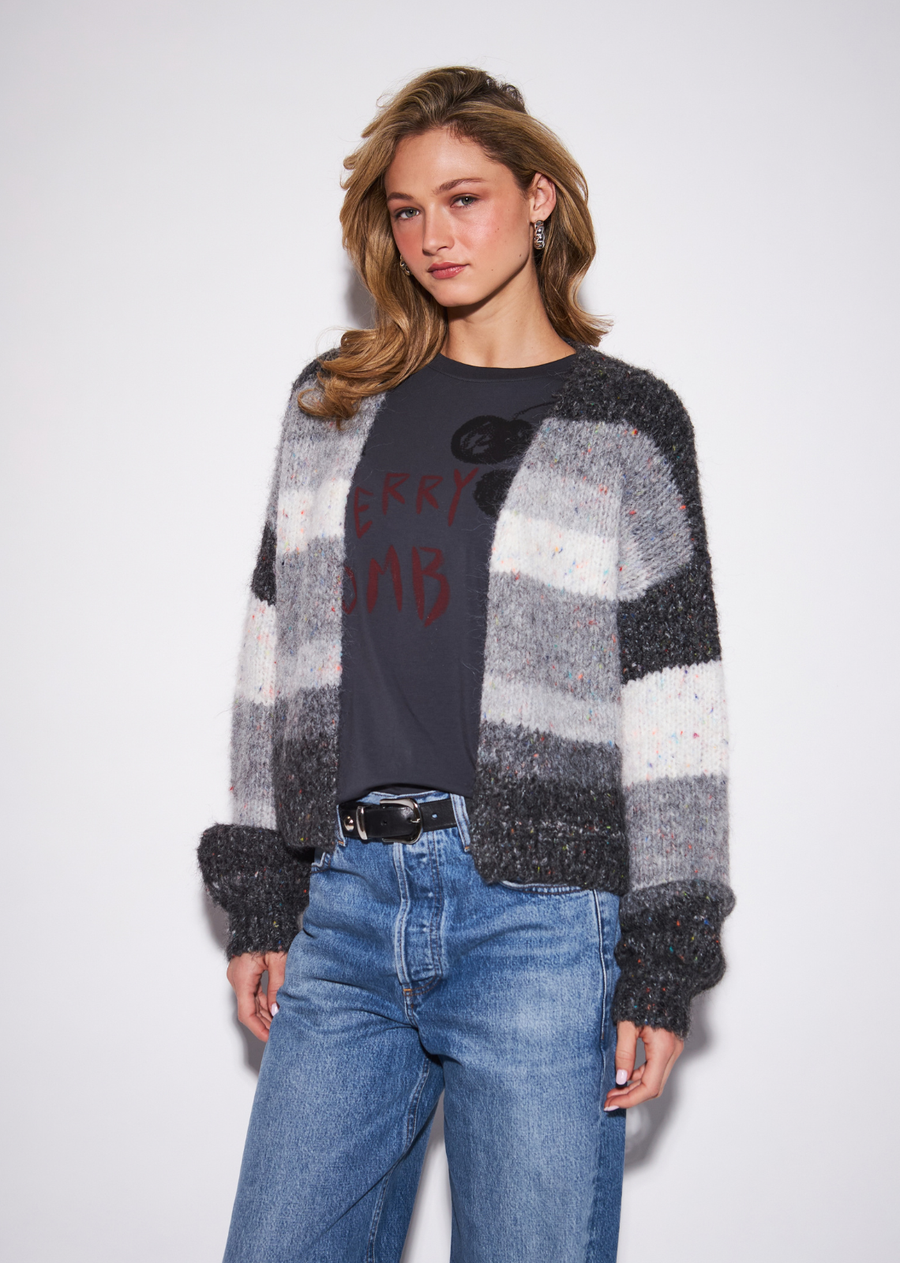 The Alanis turns the classic cardigan into a modern graphic statement through bold tonal color blocking and a relaxed silhouette.&nbsp;The restrained color palette keeps the design sophisticated, while the contrasting sections add visual structure and personality.&nbsp;Let the knit lead with simple denim and boots, or pair it with streamlined tailored trousers for a more polished, directional look.