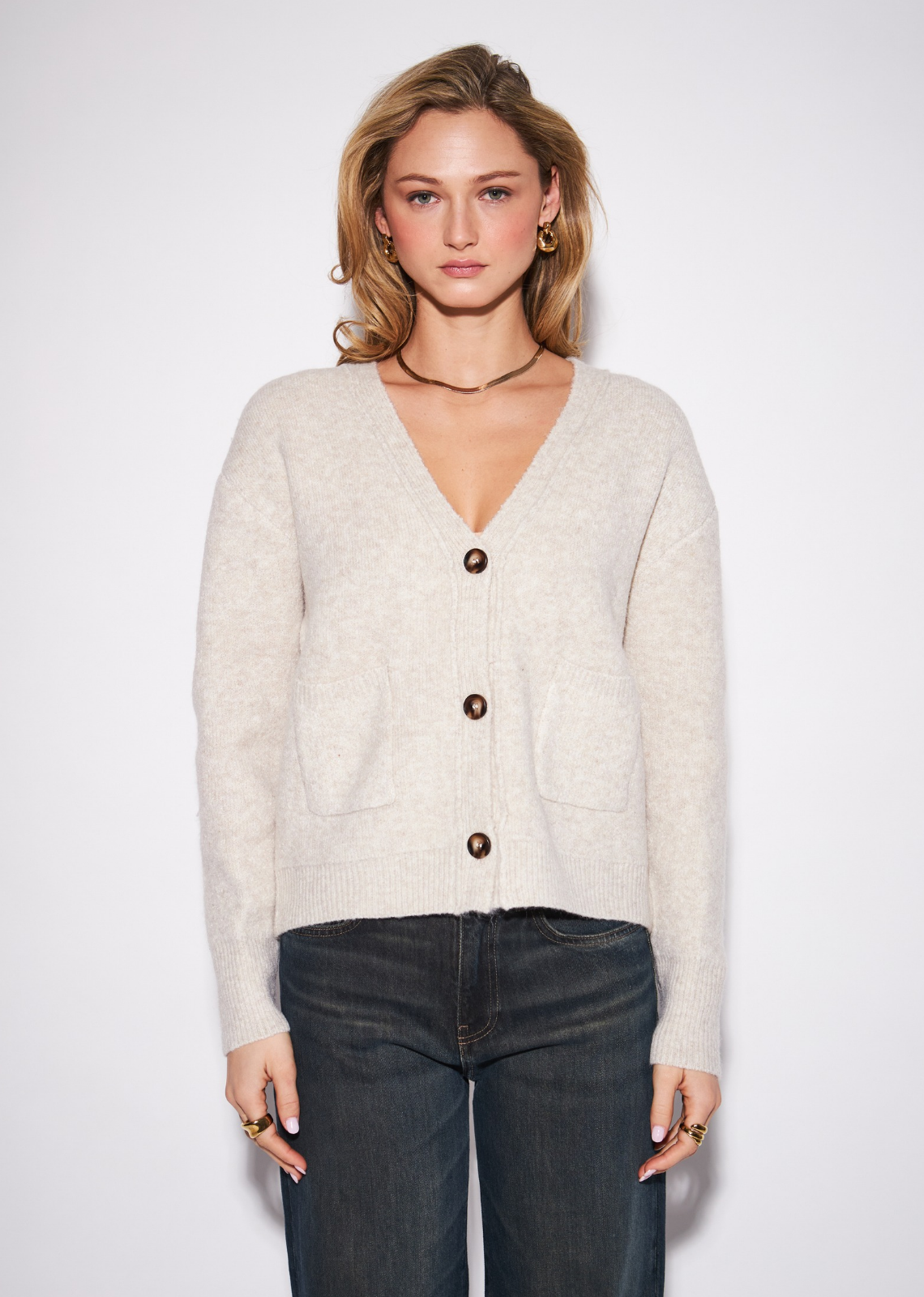 A polished everyday cardigan with a timeless, tailored feel, the Braxton features a classic V-neckline and button-front closure&nbsp;framed by a softly relaxed silhouette. The clean construction makes it an effortless layering piece, while the refined knit gives it&nbsp;enough polish to wear beyond casual dressing. Button it up and pair with wide-leg denim for an easy everyday look, or layer it&nbsp;over a crisp shirt with tailored trousers for a more elevated finish.
