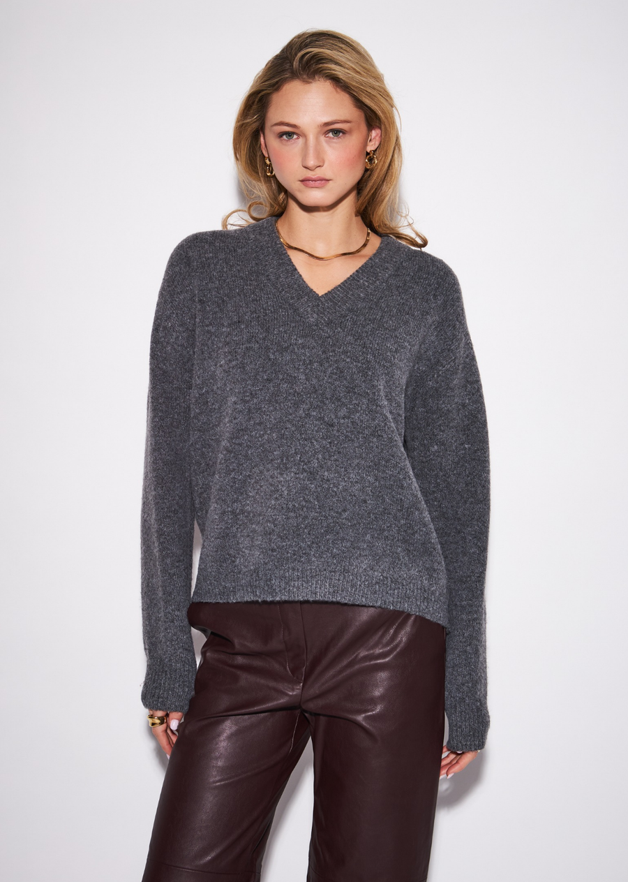 A polished everyday cardigan with a timeless, tailored feel, the Braxton features a classic V-neckline and button-front closure&nbsp;framed by a softly relaxed silhouette. The clean construction makes it an effortless layering piece, while the refined knit gives it&nbsp;enough polish to wear beyond casual dressing. Button it up and pair with wide-leg denim for an easy everyday look, or layer it&nbsp;over a crisp shirt with tailored trousers for a more elevated finish.