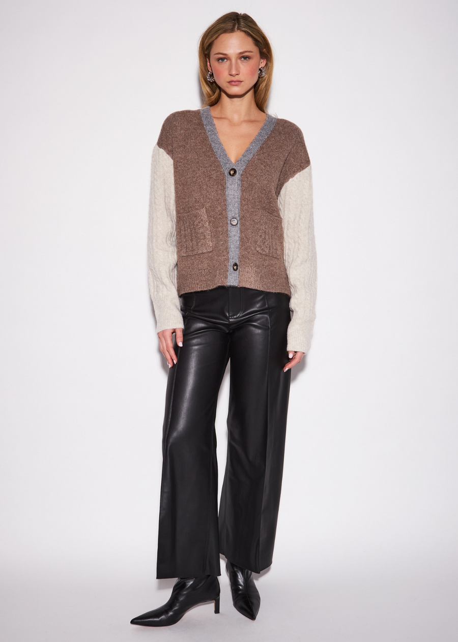 The Harlow gives the classic sleeveless knit a refined graphic update through contrast-front construction and a clean V-neckline.&nbsp;Its fitted silhouette creates a polished foundation for layering, while the contrasting detail adds subtle visual interest. Wear it with&nbsp;leather-inspired trousers for a sleek statement, pair it with denim for everyday dressing, or layer it over a crisp shirt for a&nbsp;sophisticated preppy finish.