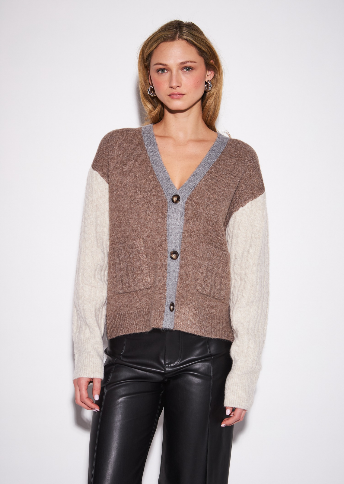 The Harlow gives the classic sleeveless knit a refined graphic update through contrast-front construction and a clean V-neckline.&nbsp;Its fitted silhouette creates a polished foundation for layering, while the contrasting detail adds subtle visual interest. Wear it with&nbsp;leather-inspired trousers for a sleek statement, pair it with denim for everyday dressing, or layer it over a crisp shirt for a&nbsp;sophisticated preppy finish.