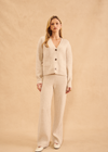 John & Jenn Braxton Cardigan- Birch. The Braxton cardi from John + Jenn is a stylish addition to any wardrobe. It features a 3-button closure, slightly cropped boxy fit and two front pockets. This cardigan is designed to provide a comfortable and flattering fit.