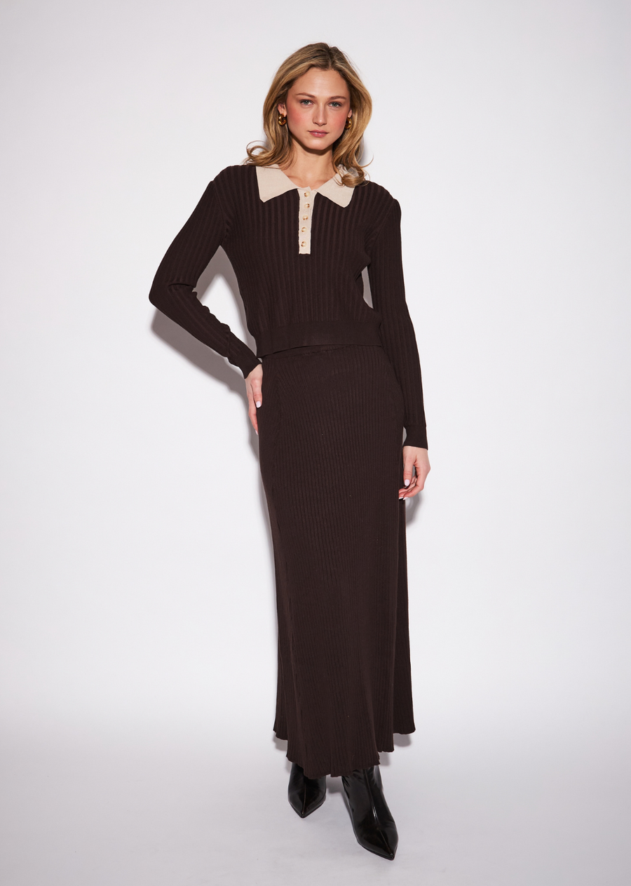 The Gisele brings a refined feminine attitude to the classic long-sleeve knit. Its fitted silhouette is sharpened by a crisp contrast&nbsp;collar and button placket, creating a polished finish with subtle preppy appeal. Style it with tailored trousers and loafers for a&nbsp;sophisticated daytime look, or pair it with a skirt and boots for a more feminine seasonal outfit.