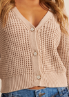 John & Jenn Ollie Cardigan- Light Mocha. Add this beautiful, neutral waffle knit cardigan to your sweater collection. Crafted in comfortable cotton, this perfect layer features a v-neckline, ribbed trim, and finished with a front button closure.