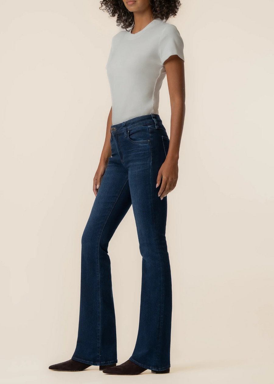 Mid-rise flare jeans in a Euro base wash with five-pocket styling and high-stretch denim for effortless style and all-day comfort.