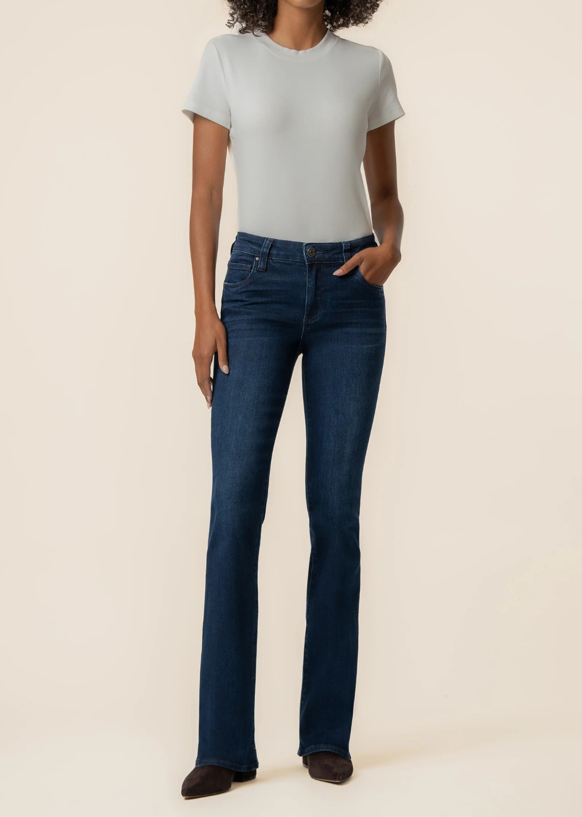 Mid-rise flare jeans in a Euro base wash with five-pocket styling and high-stretch denim for effortless style and all-day comfort.