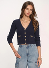 Heartloom Lida Cardi. The Lida Cardi is a classic. Made from our soft melange yarn it features novelty, gold buttons, light hardware at pockets, and a pointelle stitch. Pair it with jeans and knee-high boots for the ultimate cool-girl look.