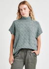 Splendid Liliana Cashblend Turtleneck Sweater. With a stunning cable stitch and an oversized fit that drapes on the frame, it's so easy to reach for our Liliana Cashblend Turtleneck Sweater. This layer-friendly sweater thrives on its own, but is also great over long sleeve tees or under chunky outerwear.