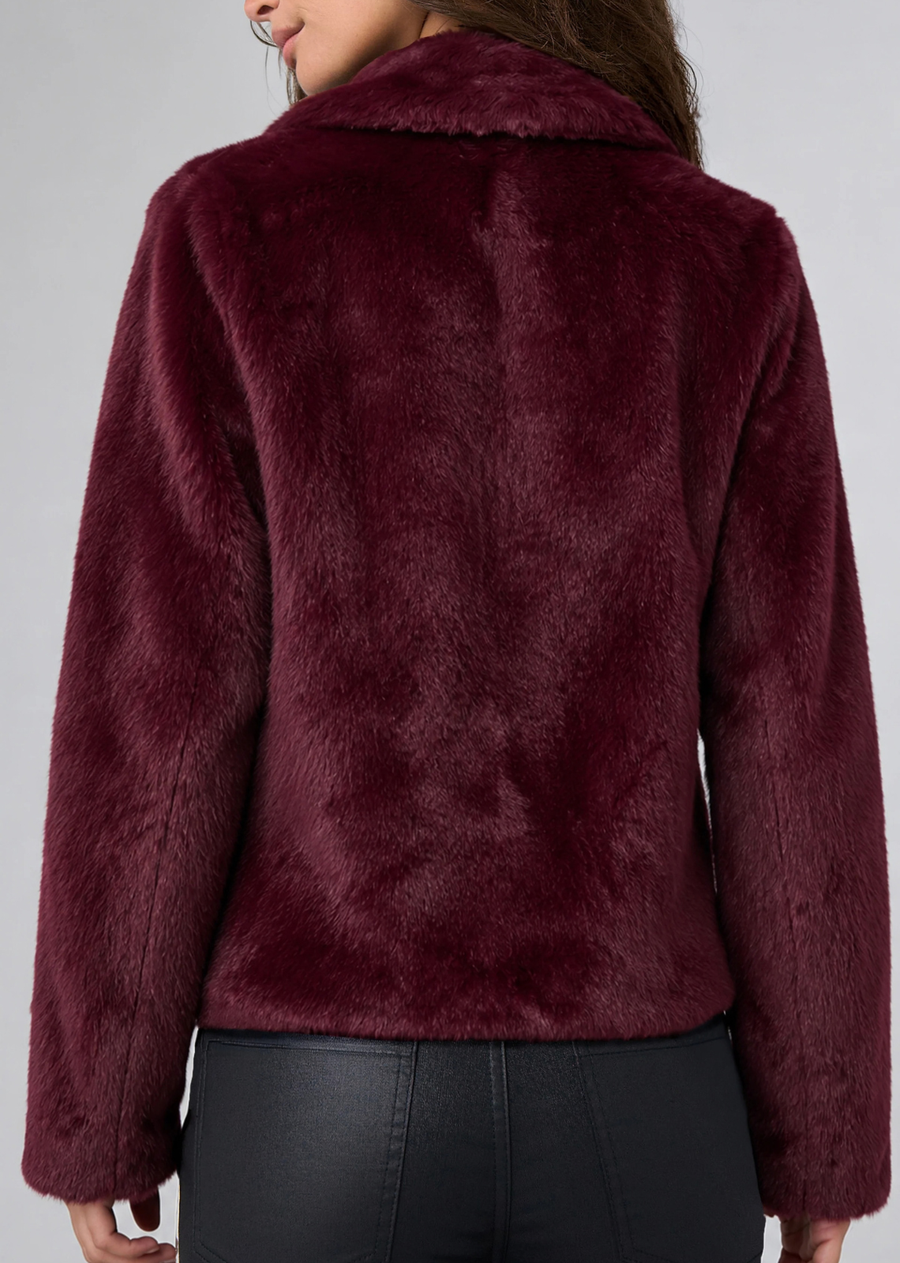 A luxe layer with an easy attitude. Crafted in plush faux fur, this jacket features a soft point collar, relaxed silhouette, and a hidden hook-and-eye closure at the neckline for a clean finish. An effortless way to add texture to denim, trousers, or dressed-up looks.