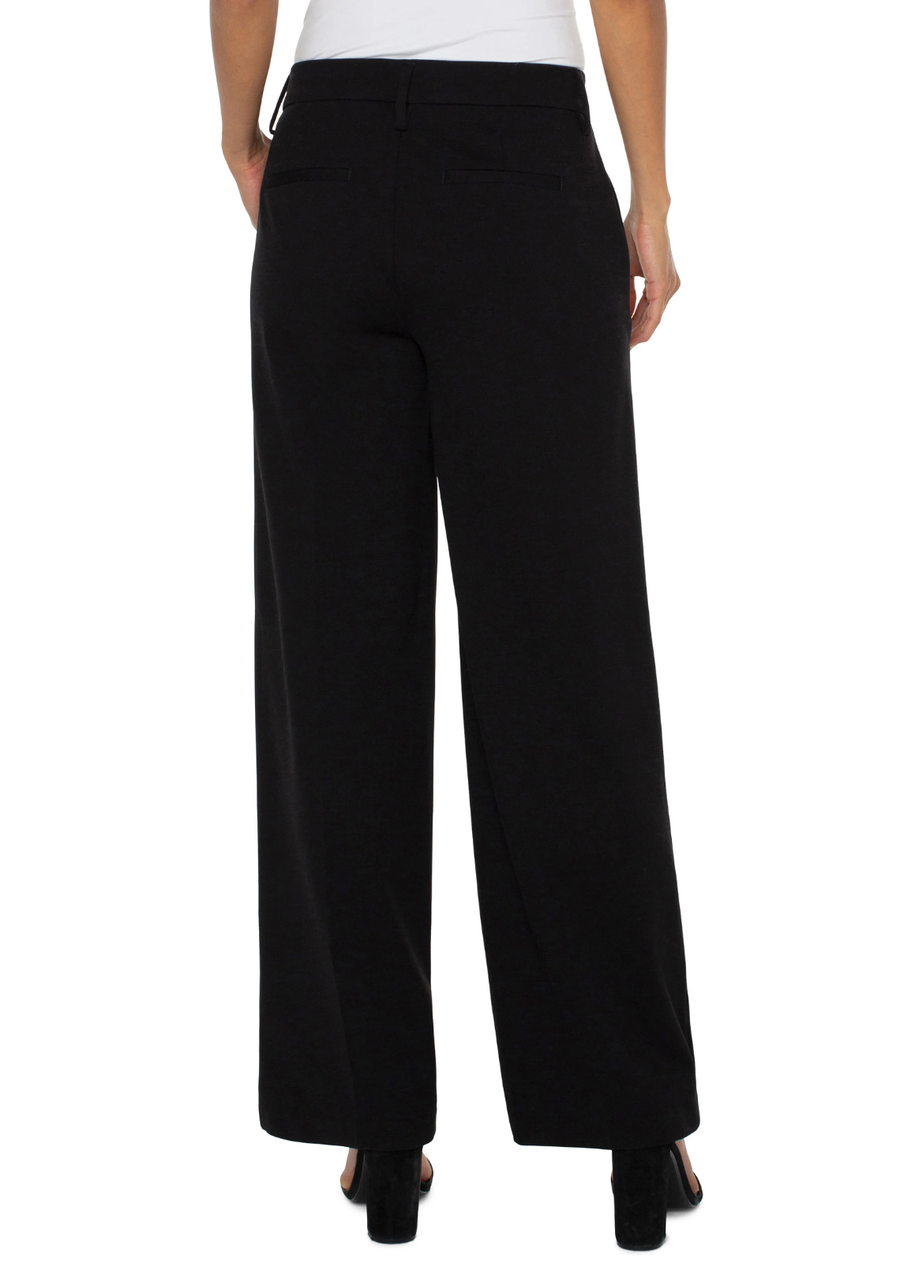 Meet the newest addition to our best-selling Kelsey collection. This wide-leg trouser delivers modern sophistication with the ease of a knit. Designed with a fluid drape and tailored details, its the kind of piece that effortlessly transitions from boardroom to brunch. Style it with a fitted blazer for a sleek head-to-toe look or dial it back with sneakers and a tee for elevated off-duty style.