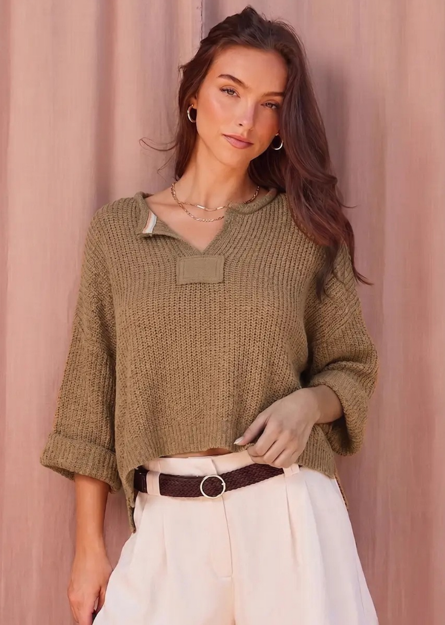 Our signature slouchy cropped sweater featuring v-neckline, 3/4 sleeves, and solid patch at front and back. Wearable all year round.