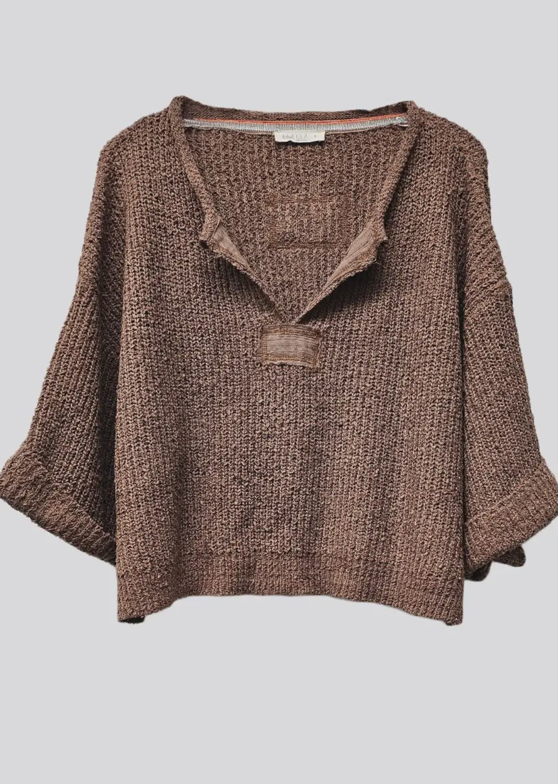 Our signature slouchy cropped sweater featuring v-neckline, 3/4 sleeves, and solid patch at front and back. Wearable all year round.