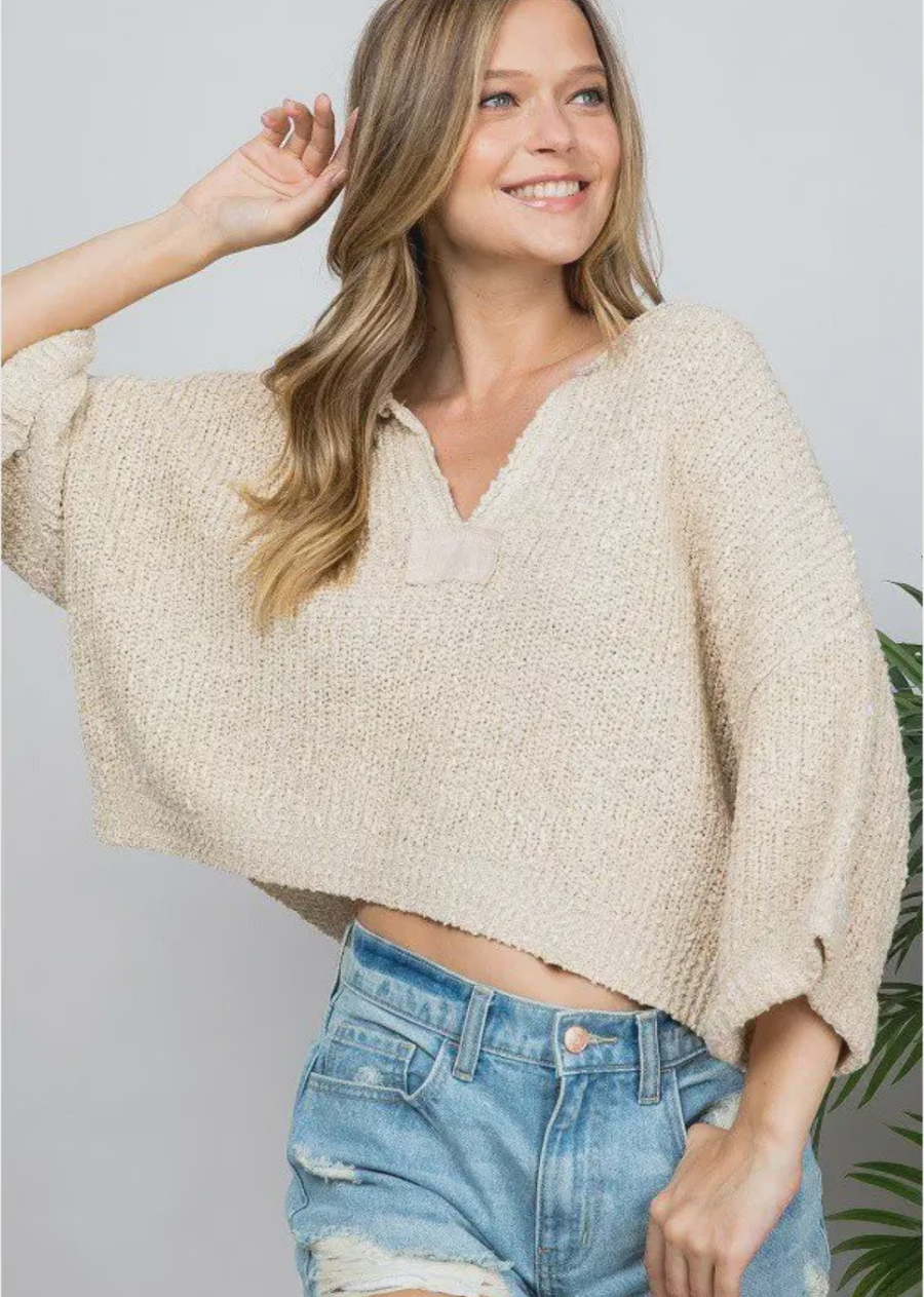 Our signature slouchy cropped sweater featuring v-neckline, 3/4 sleeves, and solid patch at front and back. Wearable all year round.