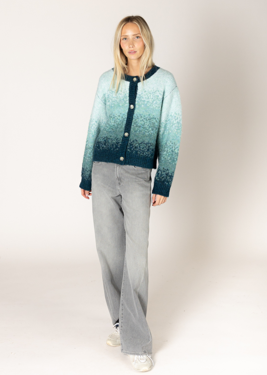 This eco-friendly cardigan offers the perfect blend of style and sustainability. With its soft and breathable fabric, it provides warmth and comfort for any season. The gradient ombré print lends a high-fashion edge to this piece, transitioning effortlessly from luxe loungewear to a street-style staple.