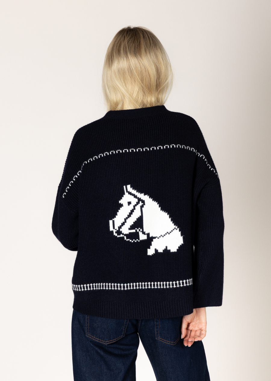 Add a touch of playful charm to your curated wardrobe this season with our must-have premium knit Fair Isle horse print cardigan. Expertly crafted in our signature, essential tri-blend yarn, this piece perfectly merges modern minimalist aesthetics with a contemporary edge. It features a tactile ribbed texture and a relaxed, easy silhouette, making it an essential statement piece and a versatile layering item you'll want to wear on repeat.