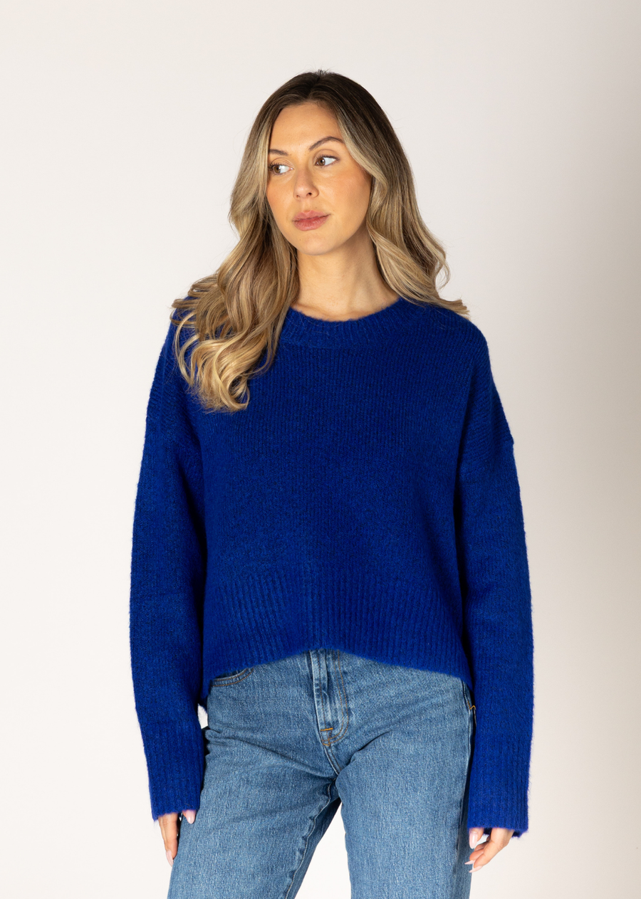 This sweater is a timeless must have, making it the perfect addition to any wardrobe. This classic crew design is effortlessly charming, featuring a ribbed hem and cuffs. Whether you're headed to work or having a casual day out, this sweater is sure to keep you cozy and stylish all day long.