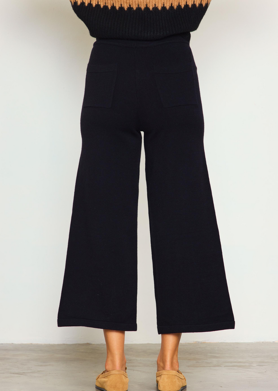 Melania Knit Pant. Our Melania Knit Crop Pants are the perfect piece to add to your wardrobe. Made from a breathable, lightweight knit material, these trousers are designed for comfort and easy movement. The length hits mid-calf for a modern take on a timeless look. 