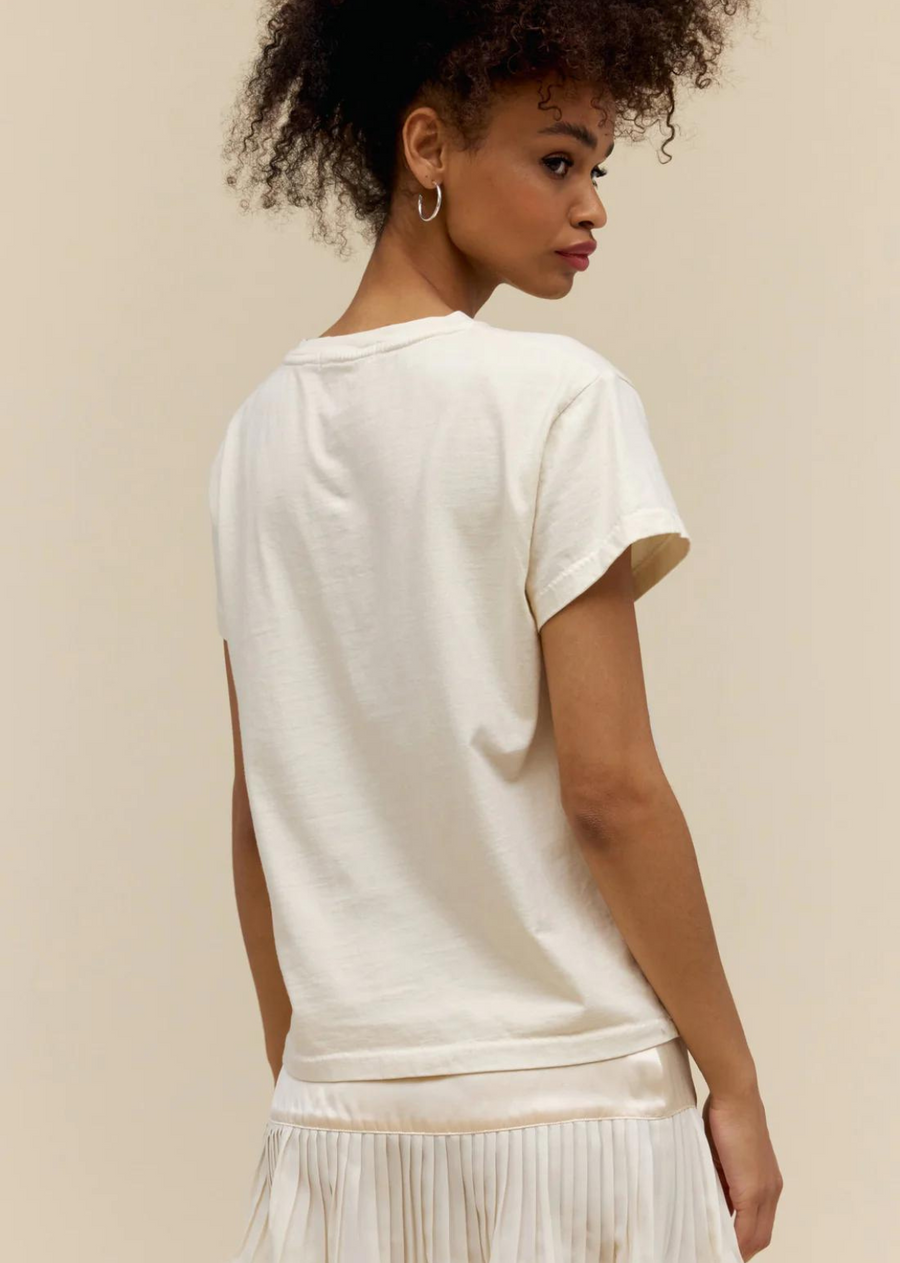 DayDreamer LA Neil Young On The Beach Tour Tee. Solo folkie Neil Young released his fifth studio album “On The Beach” that landed certified gold in the U.S. A rendition of the original cover artwork featuring Young on the Santa Monica coast is reimagined in a sun graphic. Accented in gold metallic ink.