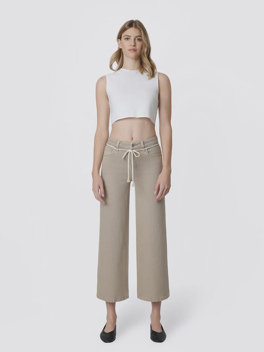 Effortlessly chic with a relaxed feel, The Olivia Drawstring Crop Wide Leg Jeans are the perfect blend of comfort and style. Designed with a flattering high-rise waist, soft stretch denim, and a unique cotton cord drawstring detail, these taupe-colored jeans bring a fresh twist to your everyday denim collection. The cropped wide-leg silhouette, finished hem, and classic five-pocket design create an easy, elevated look perfect for casual days, weekend outings, and vacation styling.