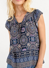 Molly Bracken Printed Top. Viscose top with geometric pattern, ruffled shoulder and front tie.
