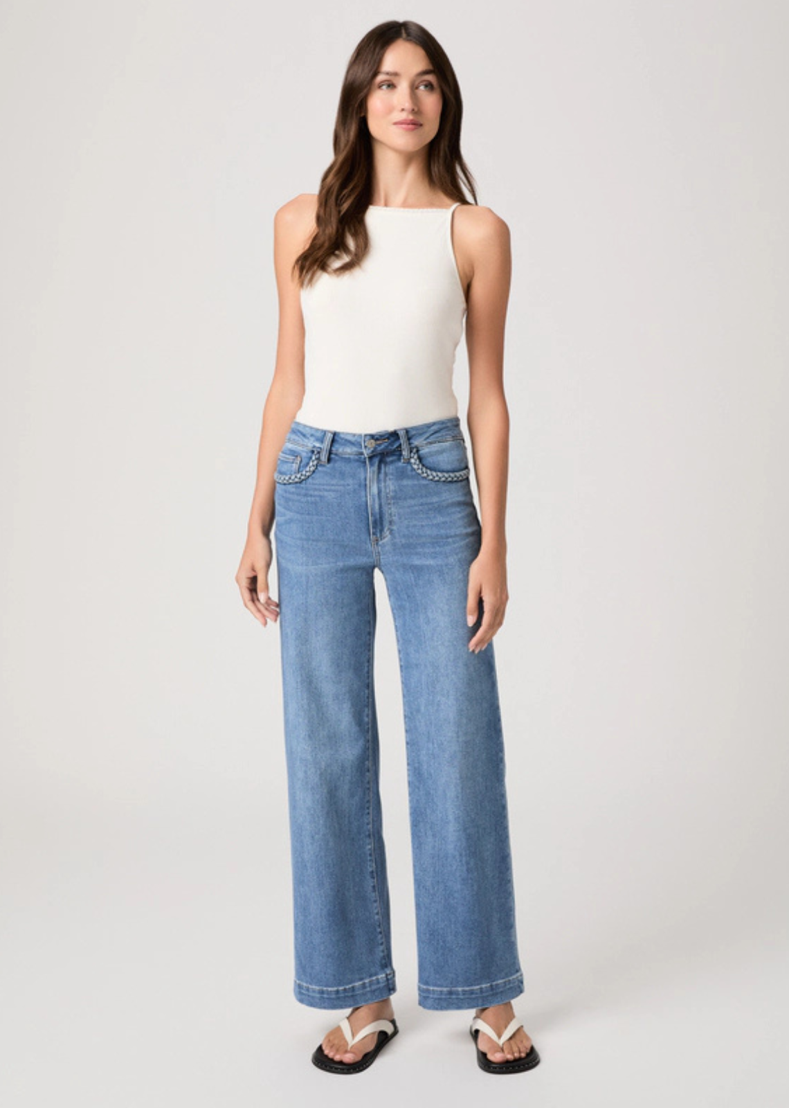 Braided detailing along the pocket edges adds a subtle handcrafted touch, elevating the classic Anessa high-rise wide leg silhouette. Cut from TRANSCEND VINTAGE denim in our medium blue Encino wash with a 31" inseam, this pair combines the signature comfort of Transcend with rich denim character for a lived-in look.