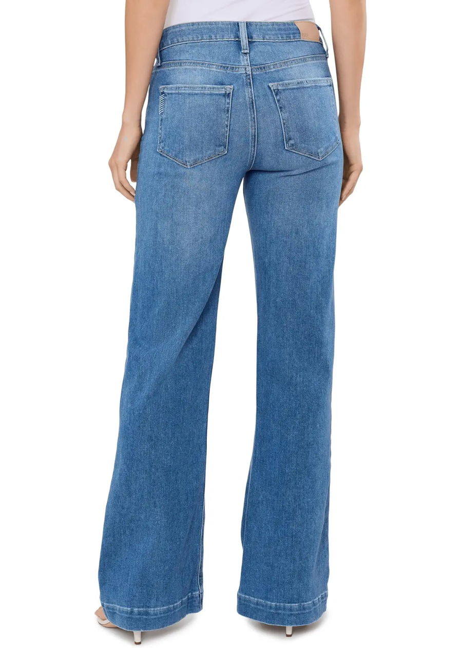This sleek wide leg is designed with a high-rise and a flattering bow leg silhouette. PAIGE Vintage takes all of the work out of breaking in your favorite pair of vintage jeans. We've combined the comfort of stretch with everything you love about authentic vintage denim to create super soft jeans that feel perfectly lived-in from the very first wear.