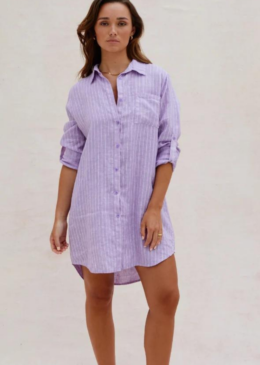 Charli Provence Shirt- Lilac. Provence Shirt is a versatile relaxed fit Linen boyfriend shirt with a subtle stripe. An easy throw on this summer that you can team with relaxed soft tailored pants, denim or as an easy beach cover up. Button up shirt with tab on sleeve to for a rolled-up sleeve styling option.