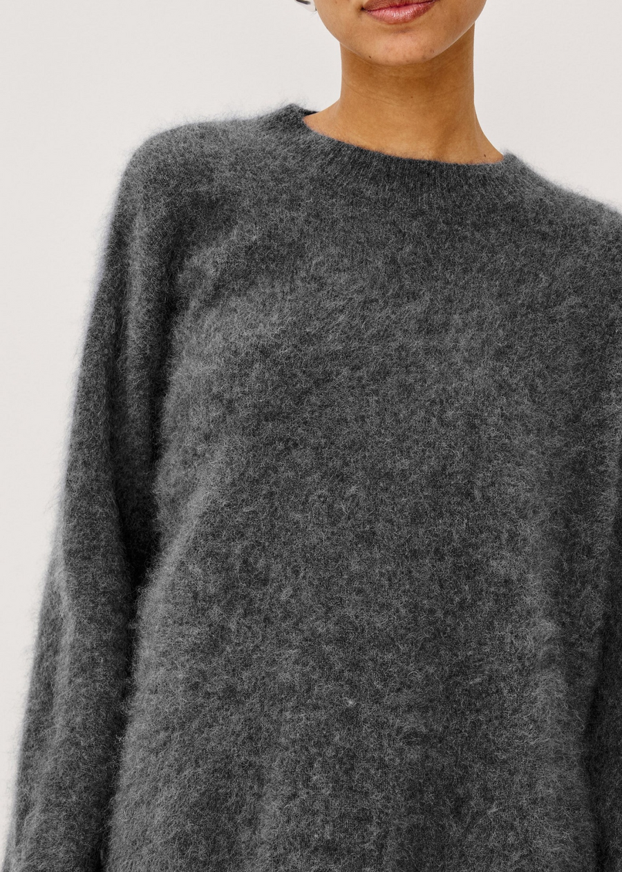 The Joel Sweater is an oversized brushed wool pullover with a mock neckline, dropped shoulders, and a relaxed, boxy fit.